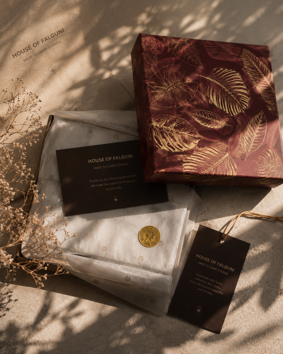 House of Falguni botanical gift box with tissue wrapping, maker card and thank-you note in warm natural light