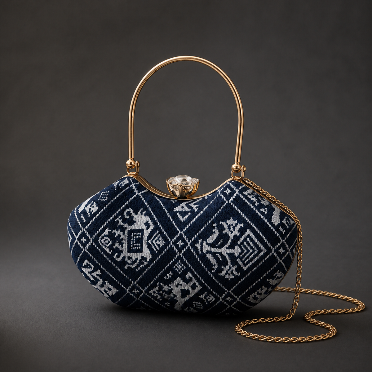 Neel Riwayat indigo and ivory Ajrakh Mashru silk frame clutch with gold-tone top handle and detachable chain