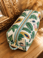 Vaan quilted hair tool bag in a cockatoo and palm print on cream, zipped shut