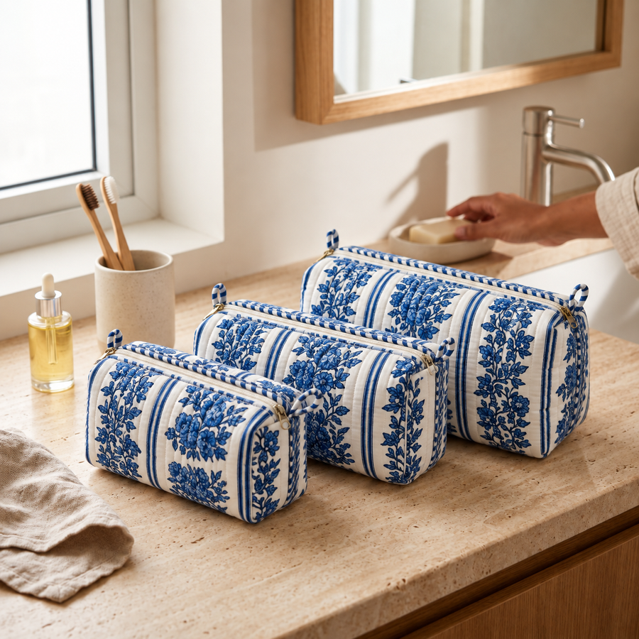 Jharna blue and white floral quilted makeup pouch set of three on a bathroom counter