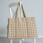 Mitti sand cane print quilted tote hanging on a white wooden chair