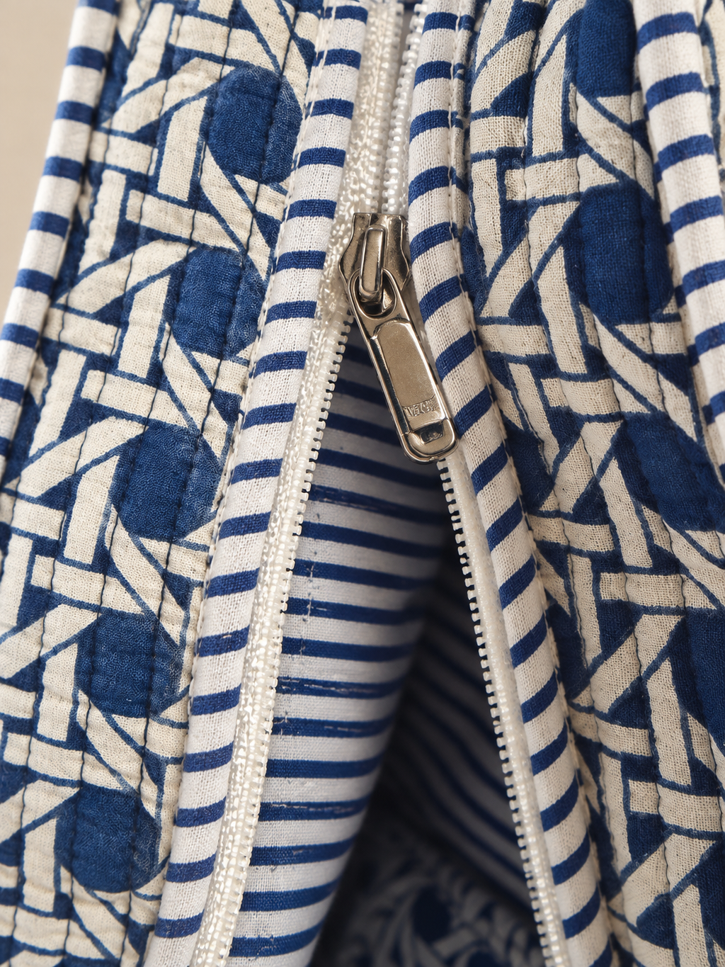Samudra blue cane print quilted tote, close-up of the zip and the blue-and-white striped lining