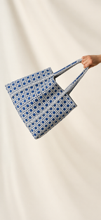 Samudra blue cane print quilted tote held out by its handles