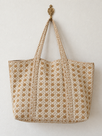 Mitti sand cane print quilted tote hanging from a brass wall hook