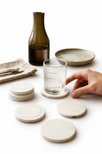 Table Companions — hand-carved marble coasters styled on a table, House of Falguni