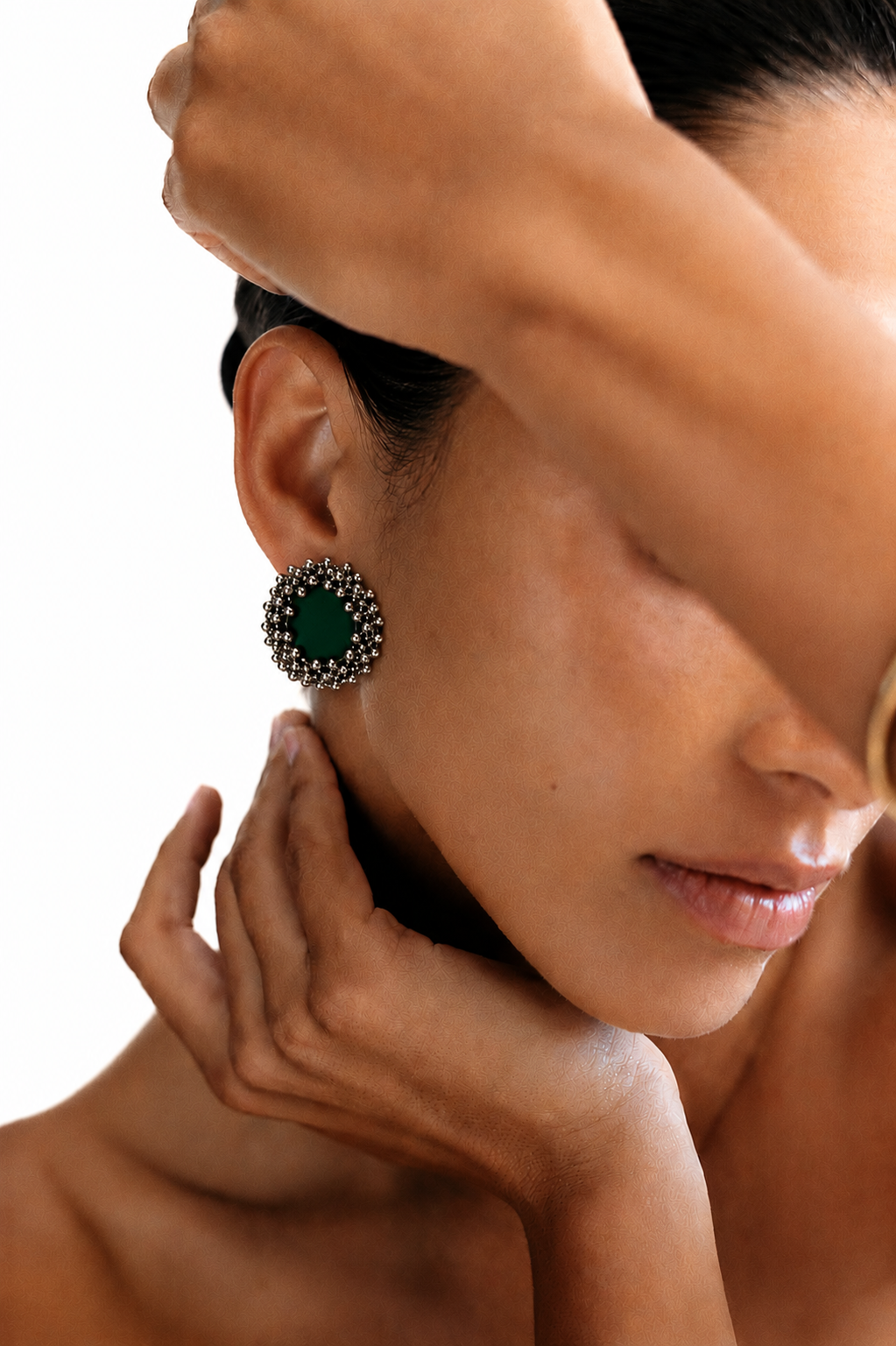 Emerald green ghungroo stud earring with a ring of oxidised silver bells