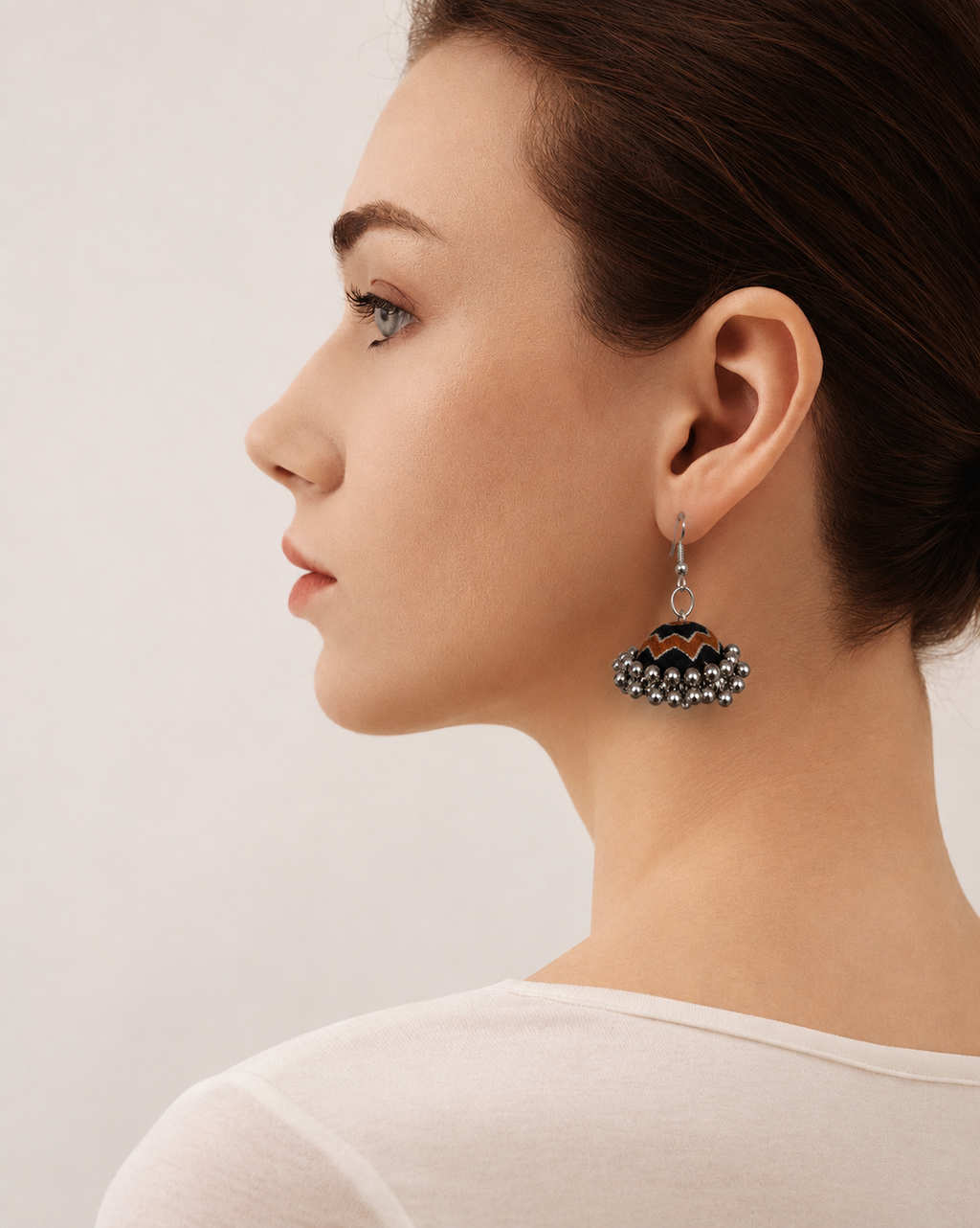 Side profile with the Neel Katha fabric jhumka hanging below the ear