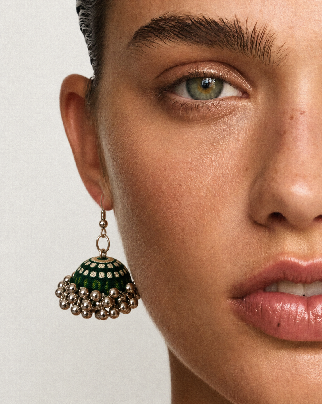 Deep green and cream striped fabric jhumka earring with a silver bead fringe — House of Falguni