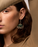 Rangrez Stripe jhumka against auburn hair, green and cream stripes running down the fabric dome