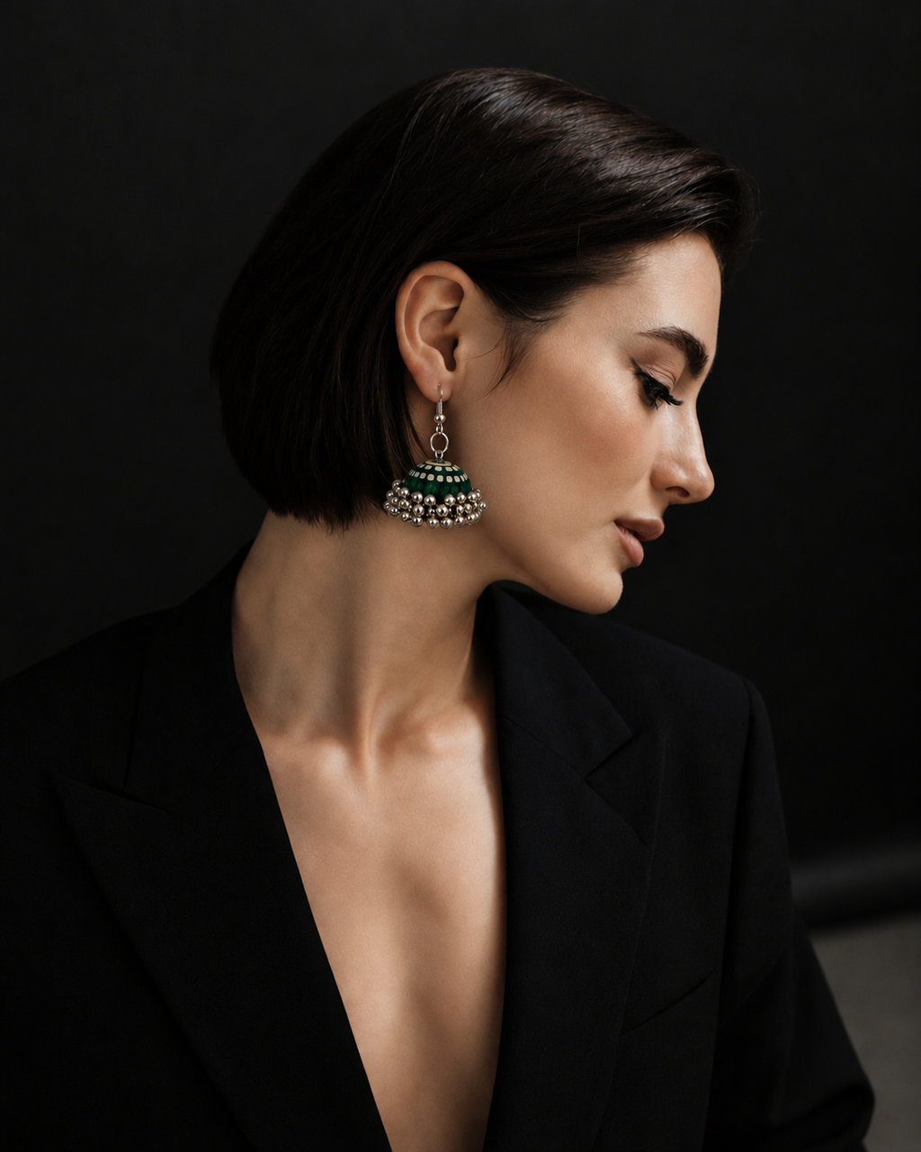 Green and cream striped jhumka worn with a short dark bob and a black blazer