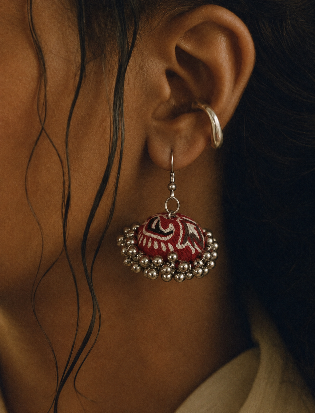 Jungle Motif jhumka worn with damp hair, red dome and cream swirls