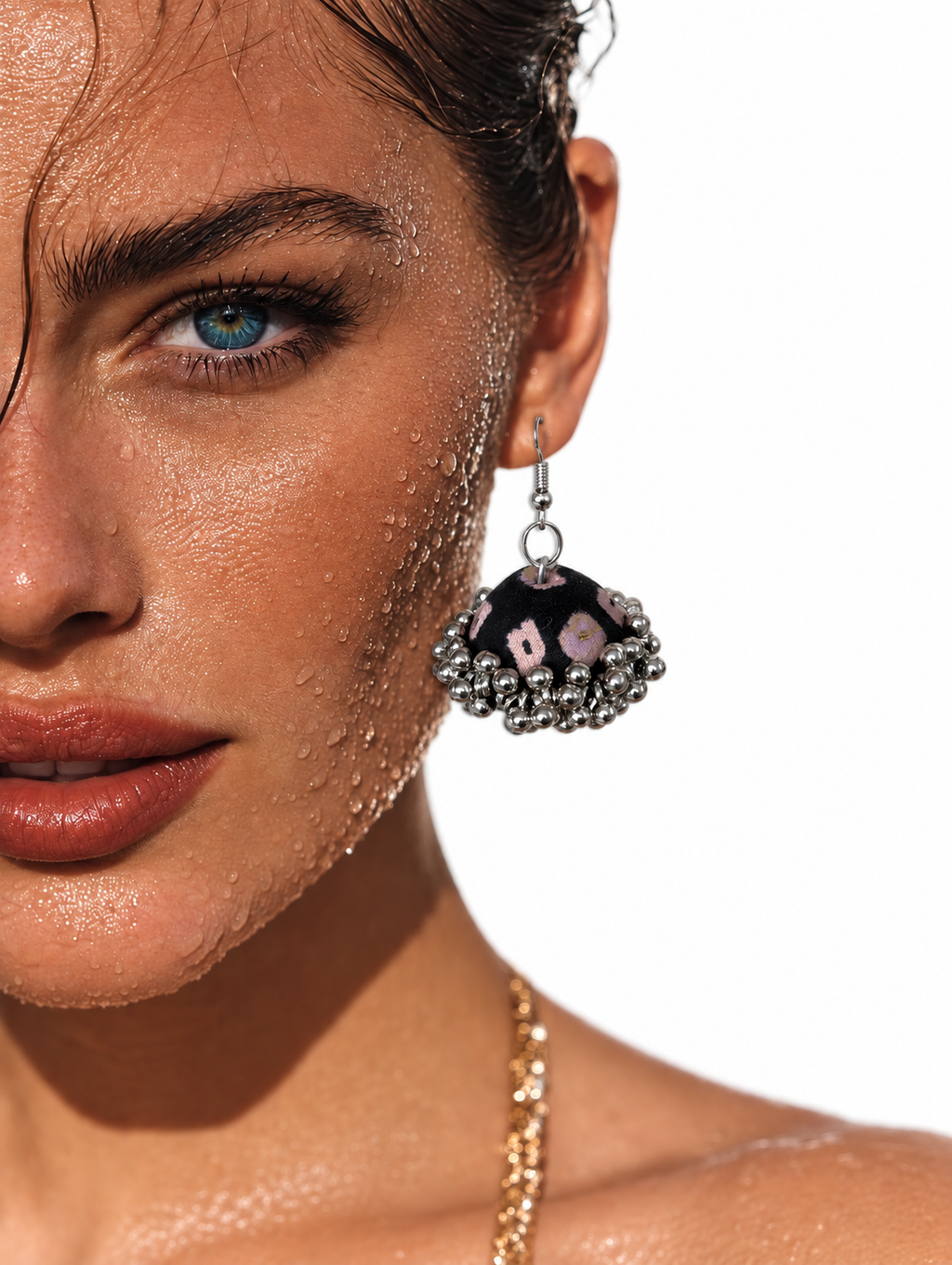 Black fabric jhumka earring scattered with soft pink and mauve florals — House of Falguni