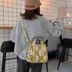 Matsya olive big cat print mini tote worn crossbody, seen from the back
