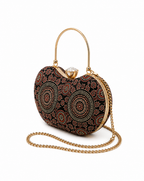Kaali Adaa black Ajrakh block-print Mashru silk handbag, studio product shot with gold-tone arched handle and pearl clasp, House of Falguni