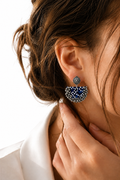 Navy polka-dot fabric chandbali earring with a row of silver ghungroo bells along the curve