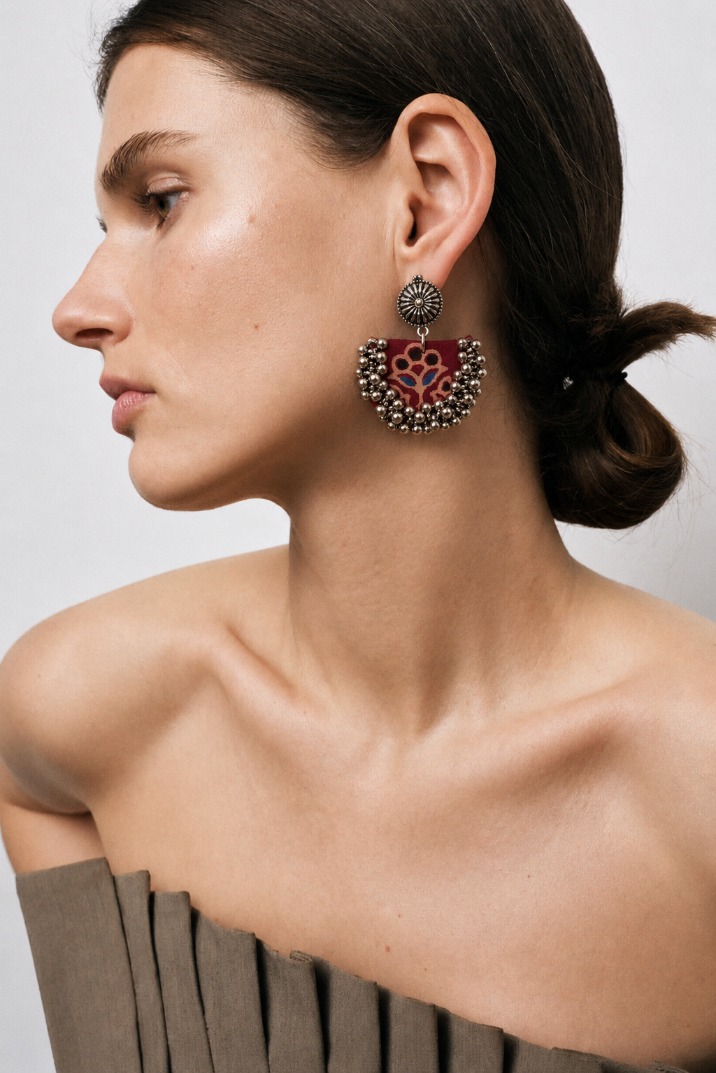 Deep red block-printed chandbali earring with a floral motif and silver ghungroo bells
