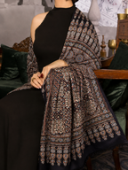 Shahi Ajrakh black modal silk stole over a black dress, cream motifs and a paisley border