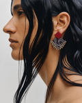 Black and Maroon Geometric Ghungroo Earrings worn in profile: deep red square stud over a black paisley-print fabric diamond edged with ghungroo bells