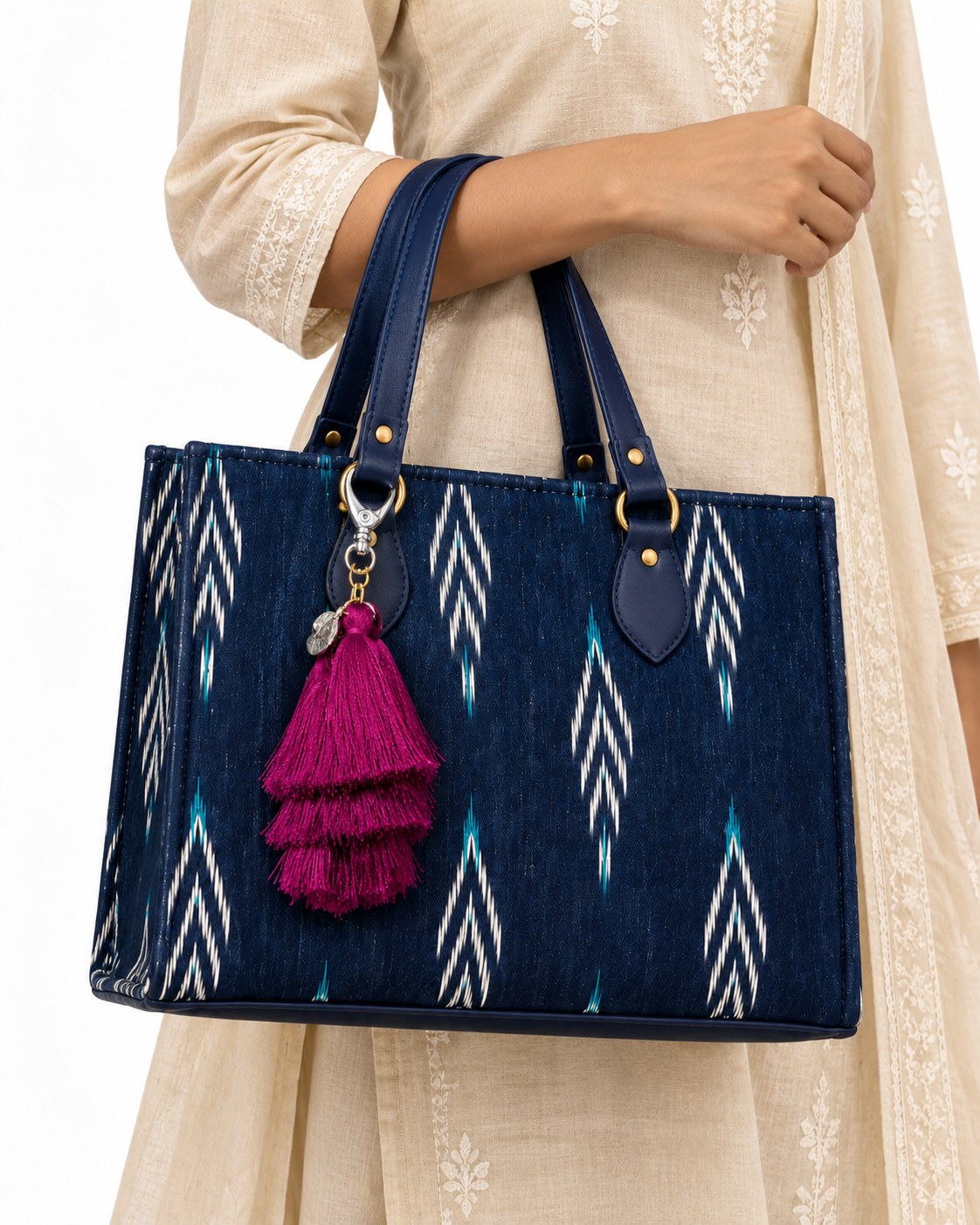 Jamuni silk tassel charm clipped to the Midnight Ikat Laptop Tote Bag, Navy