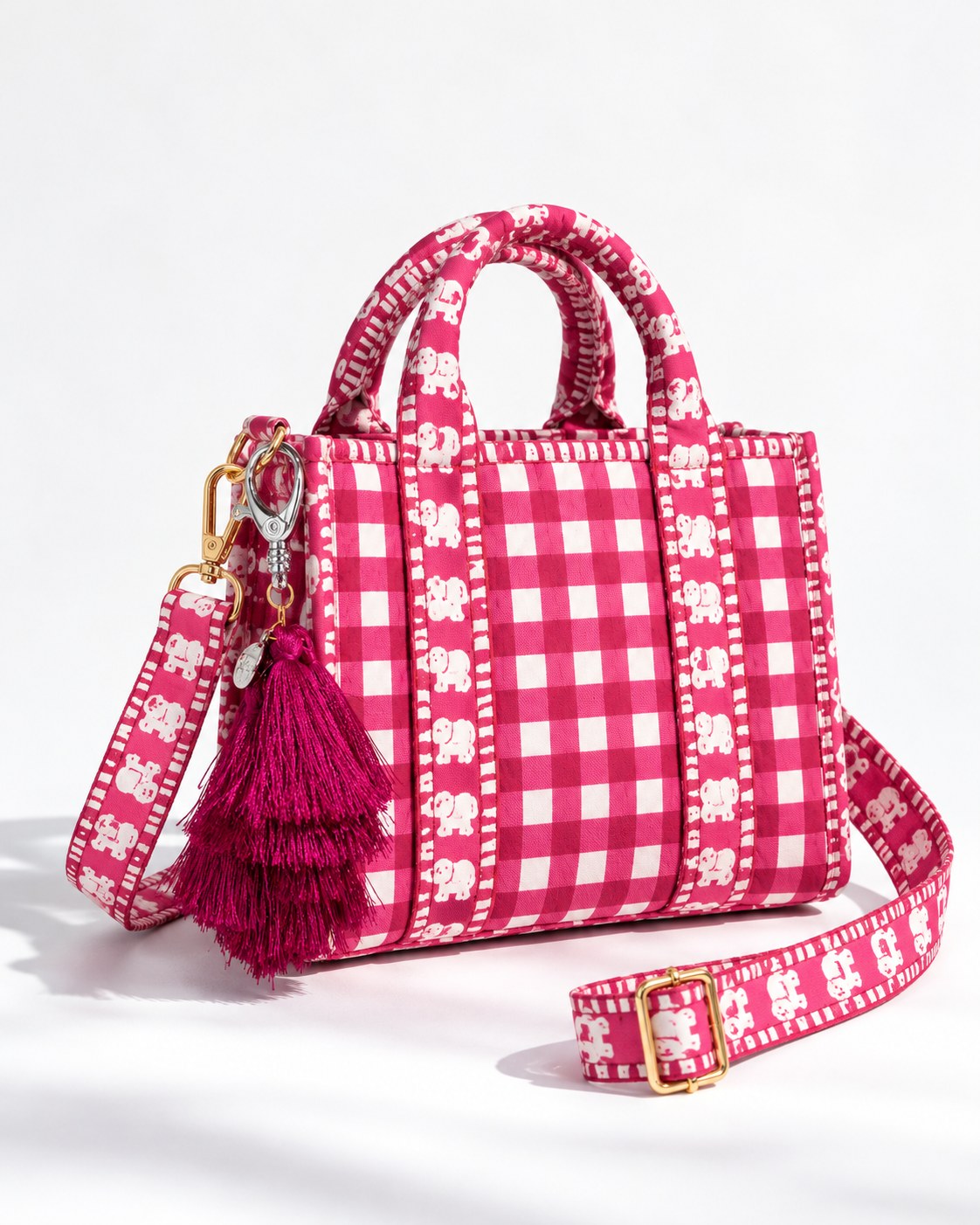 Jamuni silk tassel charm clipped to the Rani Mini Quilted Cotton Tote