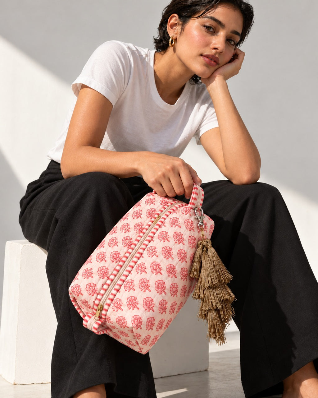 Zari silk tassel charm clipped to the Gulaab Quilted Hair Tool Bag