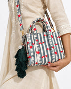 Neel Van silk tassel charm clipped to the Jal Mini Quilted Cotton Tote