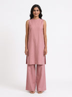 Blush pink Gulshan tunic and wide-leg pants co-ord styled on model (AI-generated styling image)