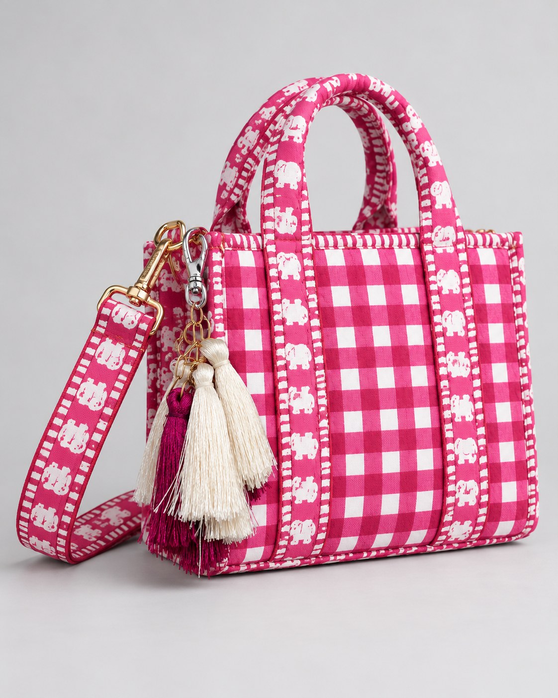 Gulal silk tassel charm clipped to the Rani Mini Quilted Cotton Tote