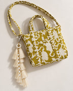 Motiya silk tassel charm clipped to the Matsya Mini Quilted Cotton Tote