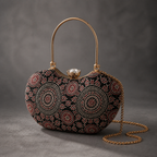 Kaali Adaa black circular-print Mashru silk handbag in charcoal studio, with gold-tone top handle and detachable chain