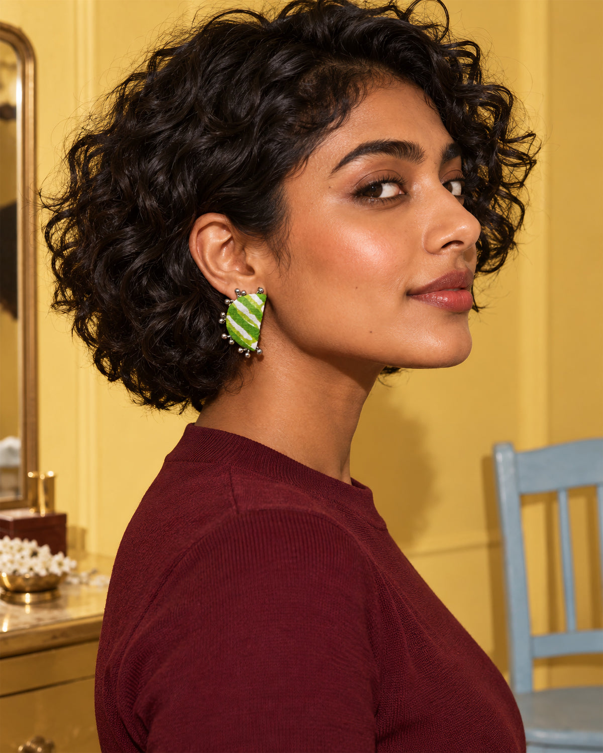 Leher Lime Green Half Moon Earrings, worn, maroon top, yellow wall