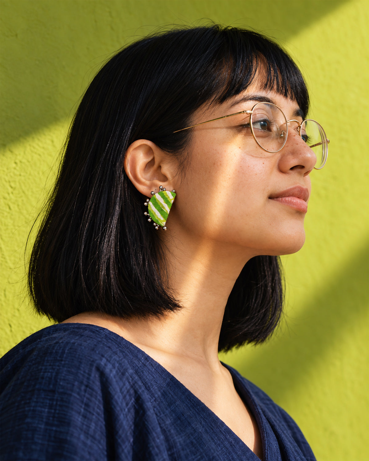 Leher Lime Green Half Moon Earrings, worn, round glasses, chartreuse wall
