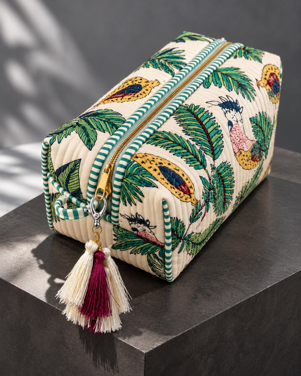 Abeer silk tassel charm clipped to the Vaan Quilted Hair Tool Bag