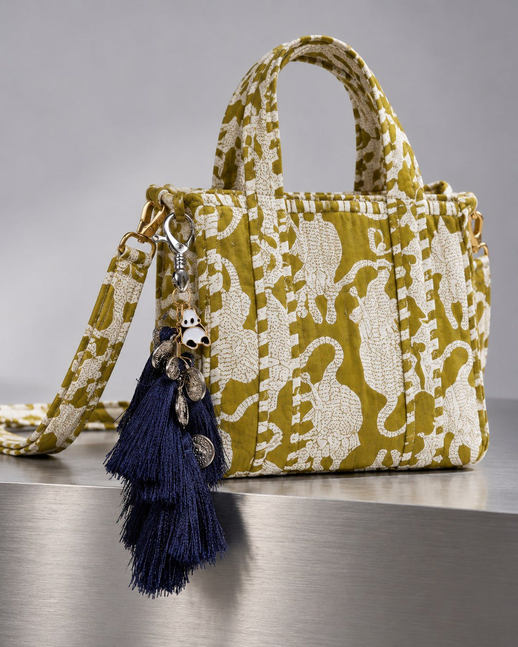 Nisha silk tassel charm clipped to the Matsya Mini Quilted Cotton Tote