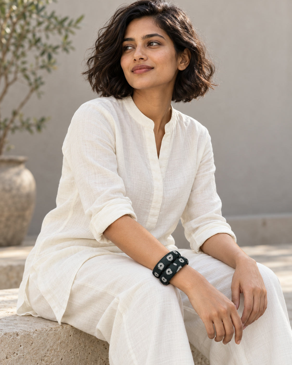 Panna Phool dark green fabric bangles styled with a white cotton kurta set
