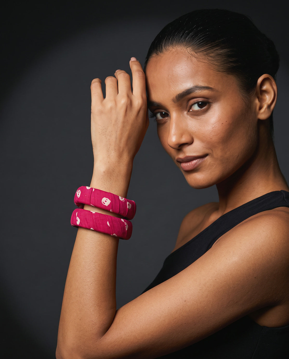 Magenta printed cotton bangles worn with a black top for the evening