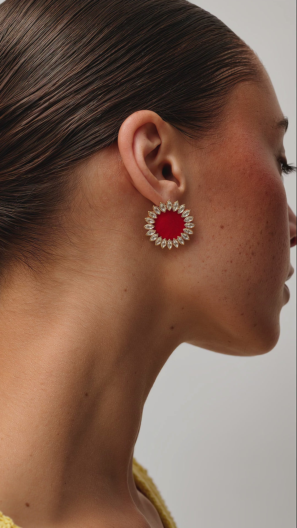 Maroon Floral Kundan earrings, pointed kundan petals around a deep red fabric centre, worn in profile as she breathes softly (AI-generated styling video)