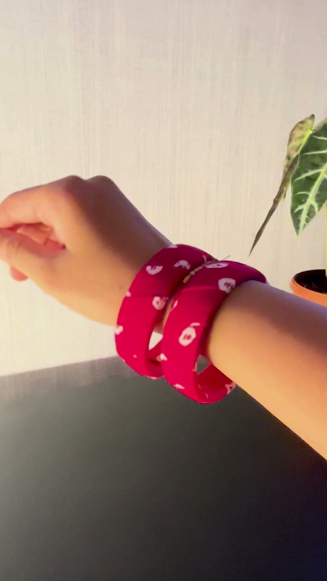 Gulnaar Magenta Pink Floral Fabric Bangles, Set of 2: Gulnaar magenta floral fabric bangles, a pair, turned on the wrist