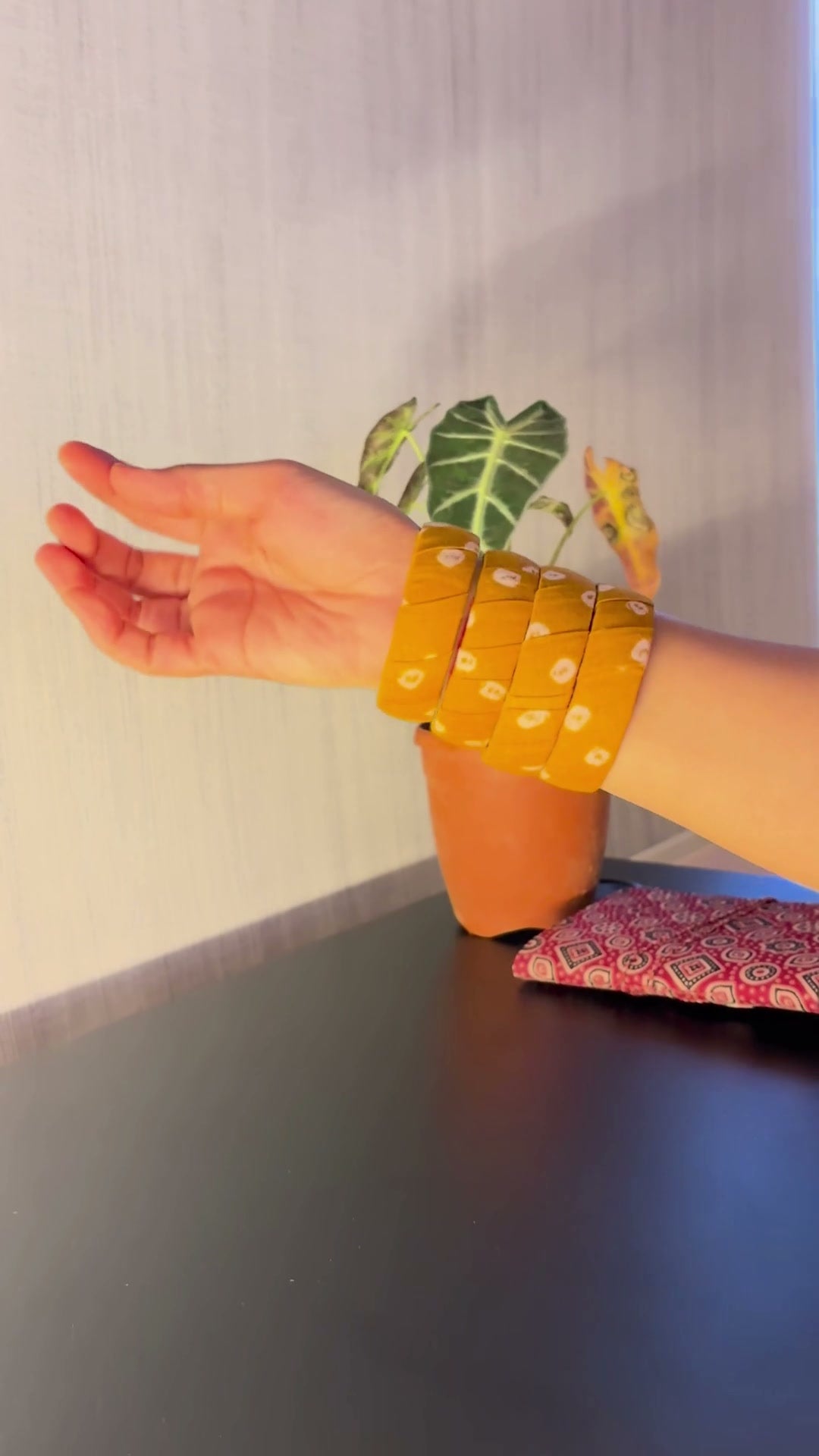 Haldi Phool Mustard Yellow Floral Fabric Bangles, Set of 2: Haldi Phool mustard yellow floral fabric bangles slipped on and stacked at the wrist