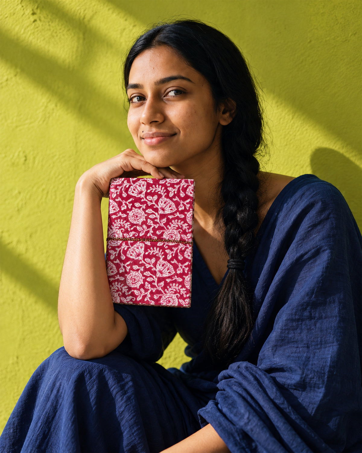 Rani Phool Block Print Fabric Diary, 200 Unruled Pages, held at the chest, navy dress, chartreuse wall